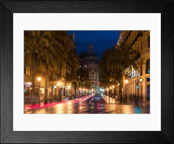 Framed Print : Night street view in Valencia downtown, Spain. Palm Trees in Spanish City of Valencia Framed Print : Night street view in Valencia downtown, Spain. Palm Trees in Spanish City of Valencia
