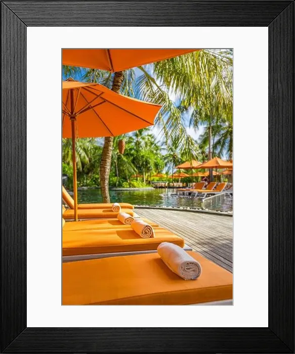Framed Print : Luxurious resort, tropical poolside, infinity swimming pool with orange loungers and umbrellas under palm trees. Summer vacation, holiday. Spa, fun Framed Print : Luxurious resort, tropical poolside, infinity swimming pool with orange loungers and umbrellas under palm trees. Summer vacation, holiday. Spa, fun