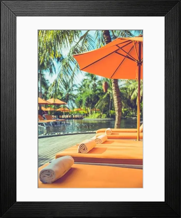 Framed Print : Luxurious resort, tropical poolside, infinity swimming pool with orange loungers and umbrellas under palm trees. Summer vacation, holiday. Spa, fun Framed Print : Luxurious resort, tropical poolside, infinity swimming pool with orange loungers and umbrellas under palm trees. Summer vacation, holiday. Spa, fun