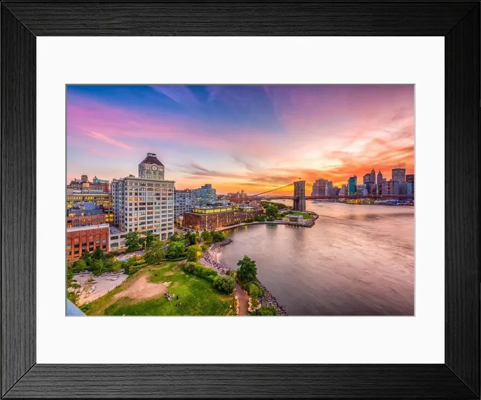 Framed Print : New York, New York, USA skyline of Manhattan over the East River with the Brooklyn Bridge after sunset Framed Print : New York, New York, USA skyline of Manhattan over the East River with the Brooklyn Bridge after sunset