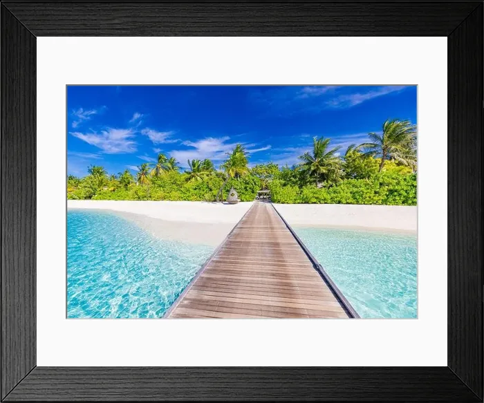 Framed Print : Maldives island perfect beach, long wooden jetty into beautiful paradise tropical landscape. Exotic nature, luxury summer travel vacation destination Framed Print : Maldives island perfect beach, long wooden jetty into beautiful paradise tropical landscape. Exotic nature, luxury summer travel vacation destination