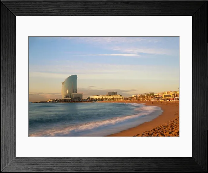Framed Print : Barceloneta Beach in Barcelona with colorful sky at sunrise. Seafront, beach, coast in Spain. Suburb of Barcelona, Catalonia Framed Print : Barceloneta Beach in Barcelona with colorful sky at sunrise. Seafront, beach, coast in Spain. Suburb of Barcelona, Catalonia