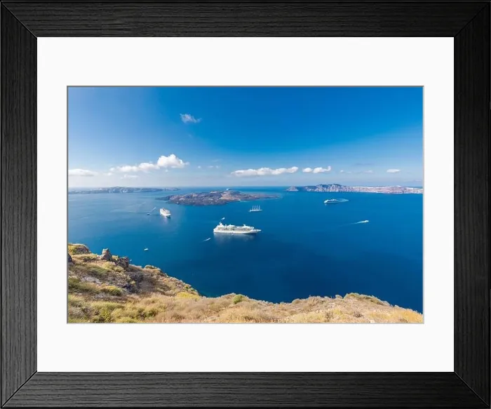 Framed Print : Cruise ship near Santorini, summer travel tourism boats in blue sea bay, cliffs of Santorini volcano island. Famous travel destination Framed Print : Cruise ship near Santorini, summer travel tourism boats in blue sea bay, cliffs of Santorini volcano island. Famous travel destination