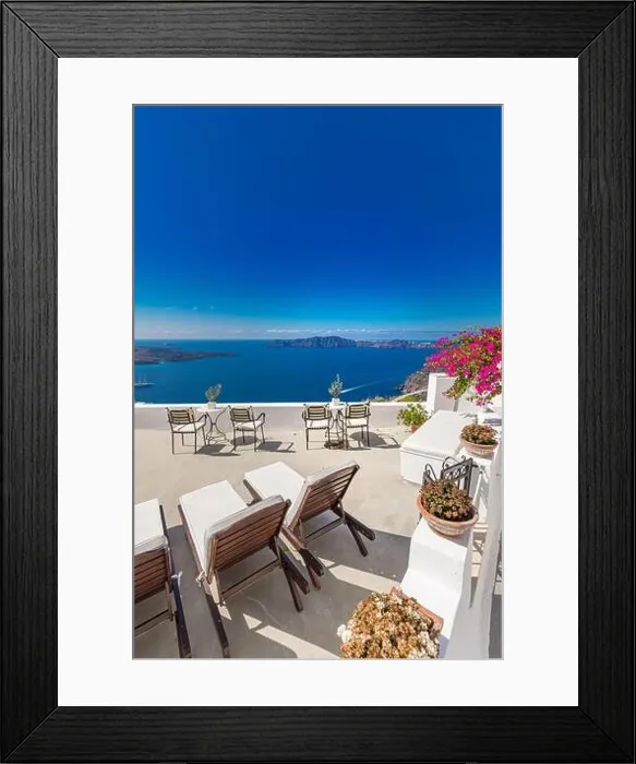 Framed Print : Oia town on Santorini island, Greece. Traditional famous white blue houses with flowers under sunny weather caldera, Aegean sea. Beautiful summer view Framed Print : Oia town on Santorini island, Greece. Traditional famous white blue houses with flowers under sunny weather caldera, Aegean sea. Beautiful summer view