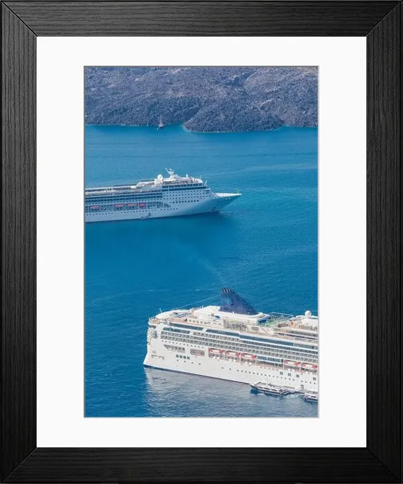 Framed Print : Cruise ship near Santorini, summer travel tourism boats in blue sea bay, cliffs of Santorini volcano island. Famous travel destination Framed Print : Cruise ship near Santorini, summer travel tourism boats in blue sea bay, cliffs of Santorini volcano island. Famous travel destination