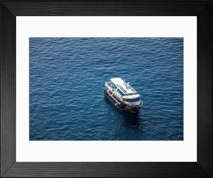 Framed Print : Cruise ship near Santorini, summer travel tourism boats in blue sea bay, cliffs of Santorini volcano island. Famous travel destination Framed Print : Cruise ship near Santorini, summer travel tourism boats in blue sea bay, cliffs of Santorini volcano island. Famous travel destination