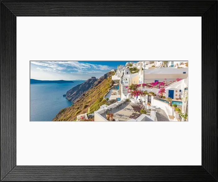 Framed Print : Oia town on Santorini island, Greece. Traditional famous white blue houses with flowers under sunny weather caldera, Aegean sea. Beautiful summer view Framed Print : Oia town on Santorini island, Greece. Traditional famous white blue houses with flowers under sunny weather caldera, Aegean sea. Beautiful summer view