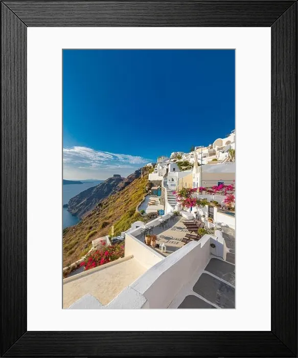 Framed Print : Oia town on Santorini island, Greece. Traditional famous white blue houses with flowers under sunny weather caldera, Aegean sea. Beautiful summer view Framed Print : Oia town on Santorini island, Greece. Traditional famous white blue houses with flowers under sunny weather caldera, Aegean sea. Beautiful summer view