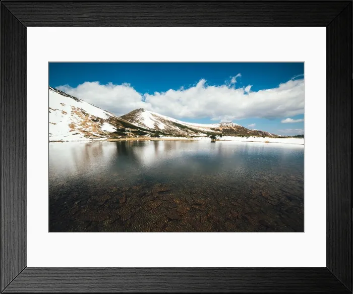 Framed Print : Frozen mountain lake with blue ice Framed Print : Frozen mountain lake with blue ice