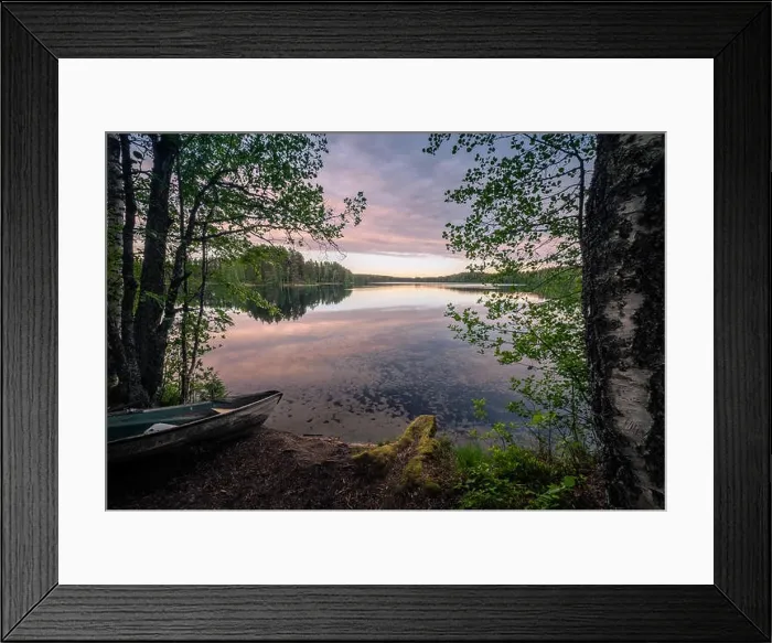 Framed Print : Scenic landscape with idyllic lake view and boat at summer evening in Finland Framed Print : Scenic landscape with idyllic lake view and boat at summer evening in Finland