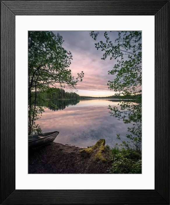 Framed Print : Scenic landscape with idyllic lake view and boat at summer evening in Finland