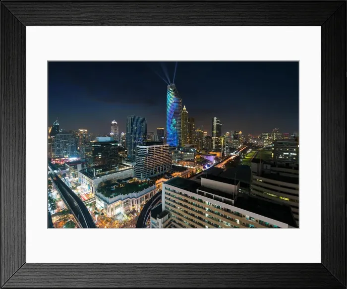 Framed Print : Night view with skyscraper in business district in Bangkok Thailand. Light show at Magnolias Ratchaprasong in Bangkok, Thailand Framed Print : Night view with skyscraper in business district in Bangkok Thailand. Light show at Magnolias Ratchaprasong in Bangkok, Thailand