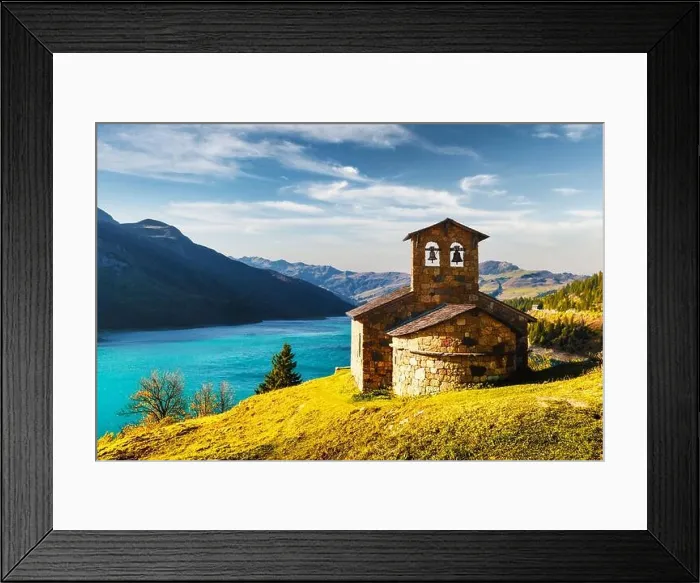 Framed Print : Sunny picturesque view of stone chapel on Roselend lake (Lac de Roselend) in France Alps (Auvergne-Rhone-Alpes). Landscape photography Framed Print : Sunny picturesque view of stone chapel on Roselend lake (Lac de Roselend) in France Alps (Auvergne-Rhone-Alpes). Landscape photography