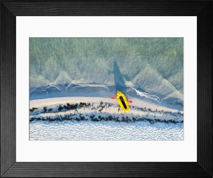 Framed Print : Yellow packraft rubber boat with red padle and turquoise water waves from top view. Beach with yellow sand glowing by sunlight Framed Print : Yellow packraft rubber boat with red padle and turquoise water waves from top view. Beach with yellow sand glowing by sunlight