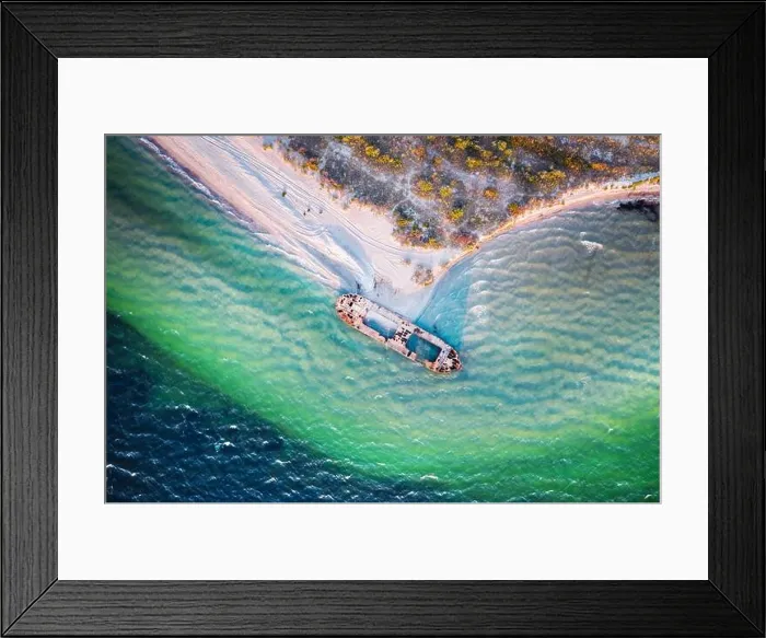 Framed Print : Old shipwreck reinforced concrete barge abandoned stand on beach on the coast of Black sea in Ukraine Framed Print : Old shipwreck reinforced concrete barge abandoned stand on beach on the coast of Black sea in Ukraine