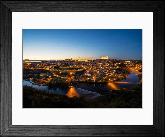 Framed Print : Panoramic view of the medieval center of the city of Toledo, Spain. It features the Tejo river, the Cathedral and Alcazar of Toledo, Spain Framed Print : Panoramic view of the medieval center of the city of Toledo, Spain. It features the Tejo river, the Cathedral and Alcazar of Toledo, Spain