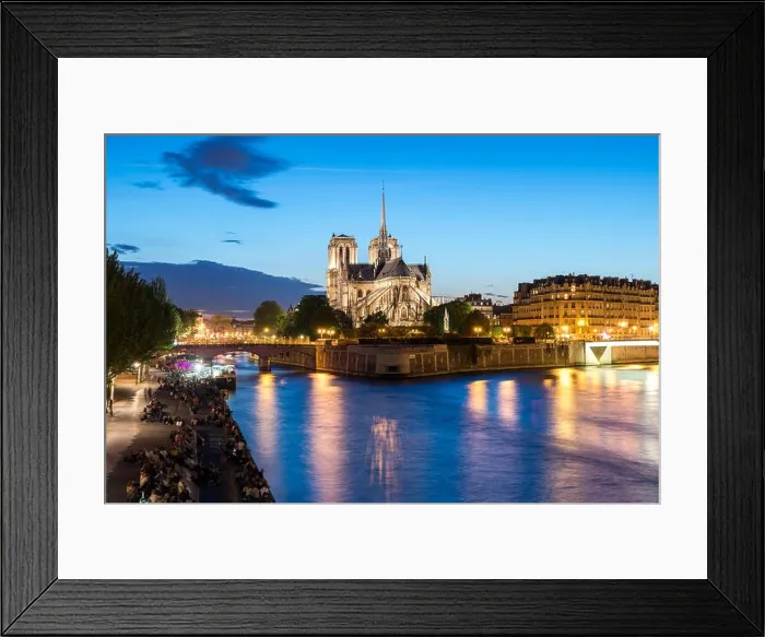 Framed Print : Notre Dame de Paris with cruise ship on Seine river at night in Paris, France Framed Print : Notre Dame de Paris with cruise ship on Seine river at night in Paris, France