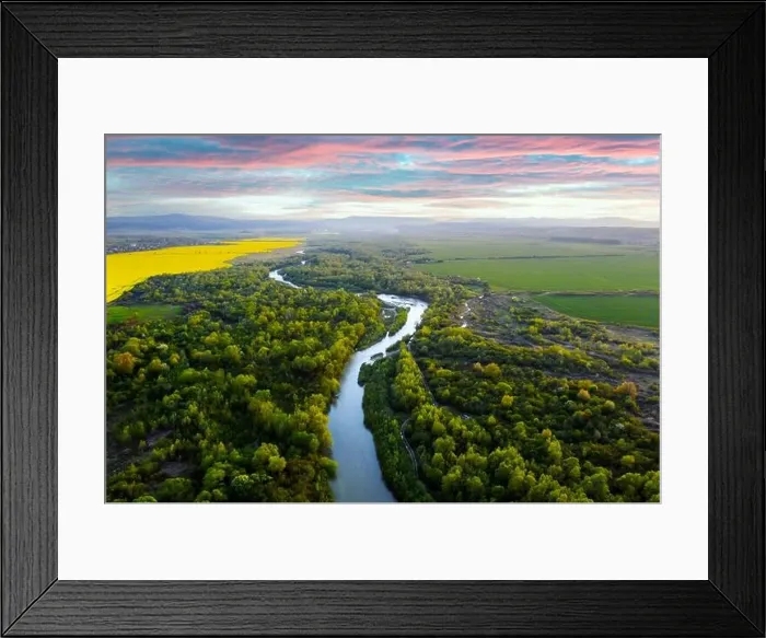 Framed Print : Flight through majestic river Dnister, lush green forest and blooming yellow rapeseed fields at sunset time. Ukraine, Europe. Landscape photography Framed Print : Flight through majestic river Dnister, lush green forest and blooming yellow rapeseed fields at sunset time. Ukraine, Europe. Landscape photography