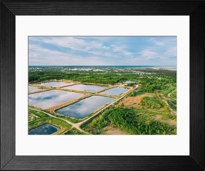 Framed Print : Aerial View Retention Basins, Wet Pond, Wet Detention Basin Or Stormwater Management Pond, Is An Artificial Pond With Vegetation Around The Perimeter Framed Print : Aerial View Retention Basins, Wet Pond, Wet Detention Basin Or Stormwater Management Pond, Is An Artificial Pond With Vegetation Around The Perimeter