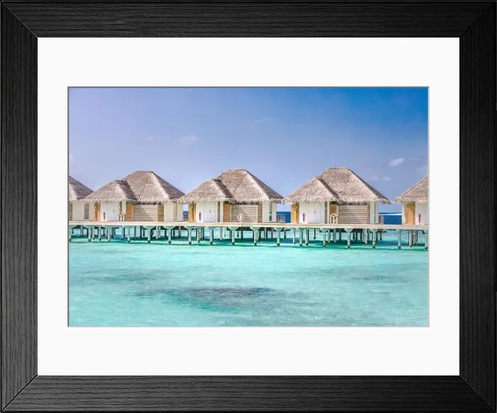 Framed Print : Maldives island water bungalows resort at islands beach. Indian Ocean, Beautiful landscape, luxury resort villas and jetty. Blue lagoon sea Framed Print : Maldives island water bungalows resort at islands beach. Indian Ocean, Beautiful landscape, luxury resort villas and jetty. Blue lagoon sea