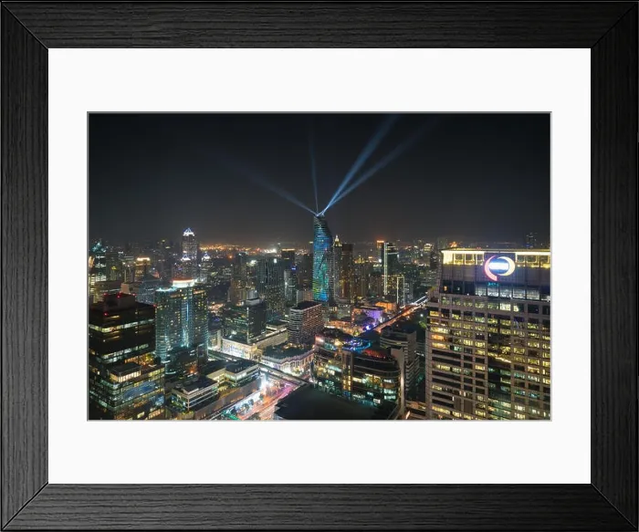 Framed Print : Night view with skyscraper in business district in Bangkok Thailand. Light show at Magnolias Ratchaprasong in Bangkok, Thailand Framed Print : Night view with skyscraper in business district in Bangkok Thailand. Light show at Magnolias Ratchaprasong in Bangkok, Thailand