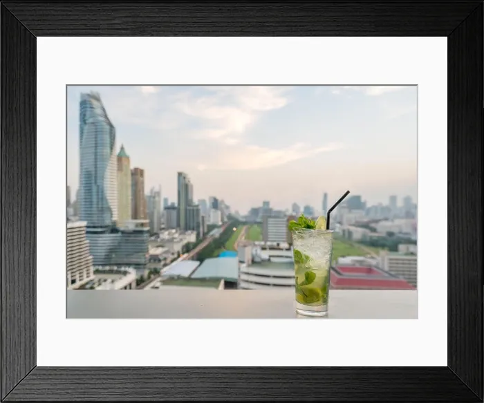 Framed Print : Mojito cocktail on table in rooftop bar with Bangkok city view point in Bangkok Thailand. Beautiful rooftop bar in Bangkok