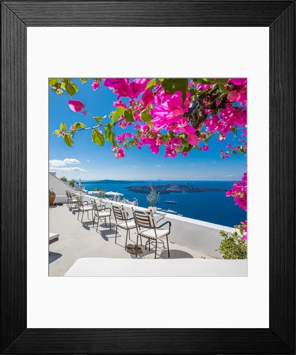 Framed Print : Santorini island, Oia, Greece. Traditional famous white architecture flowers under sunny weather over Caldera, Aegean sea. Beautiful summer vacation