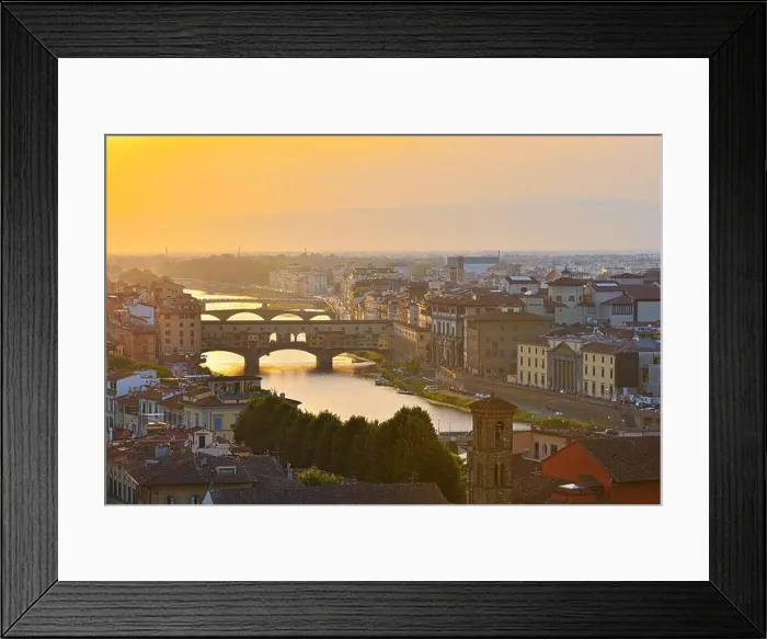 Framed Print : Florence, Italy - July 19, 2017: View of the River Arno and famous bridge Ponte Vecchio. Amazing evening golden hour light. Beautiful gold sunset in F Framed Print : Florence, Italy - July 19, 2017: View of the River Arno and famous bridge Ponte Vecchio. Amazing evening golden hour light. Beautiful gold sunset in F