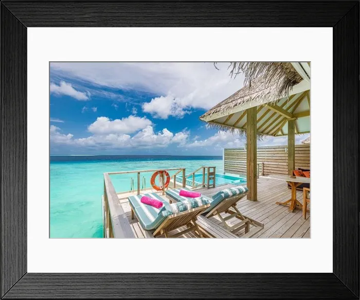 Framed Print : Fantastic over water villa, terrace view with sun beds chairs under umbrella, luxury pool hotel with stunning ocean view. Beautiful spa or wellness Framed Print : Fantastic over water villa, terrace view with sun beds chairs under umbrella, luxury pool hotel with stunning ocean view. Beautiful spa or wellness