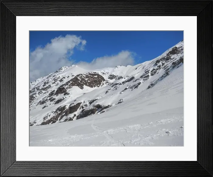 Framed Print : Winter in the rocky mountains covered with snow against blue sky with small clouds Framed Print : Winter in the rocky mountains covered with snow against blue sky with small clouds