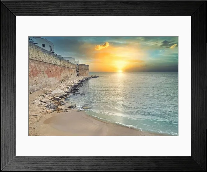 Framed Print : Early morning sunrise in Monopoli, Italy. City wals near Adriatic Sea against cloudy sunrise Framed Print : Early morning sunrise in Monopoli, Italy. City wals near Adriatic Sea against cloudy sunrise