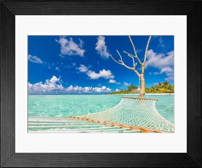 Framed Print : Luxury beach. Luxury travel background. Summer vacation or holiday concept on tropical beach, white sand and an amazing swing or hammock over blue sea Framed Print : Luxury beach. Luxury travel background. Summer vacation or holiday concept on tropical beach, white sand and an amazing swing or hammock over blue sea