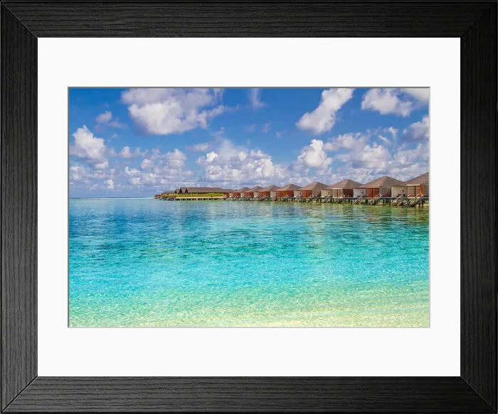 Framed Print : Luxury water bungalows and amazing blue sea in Maldives island. Paradise concept for summer vacation and holiday design Framed Print : Luxury water bungalows and amazing blue sea in Maldives island. Paradise concept for summer vacation and holiday design