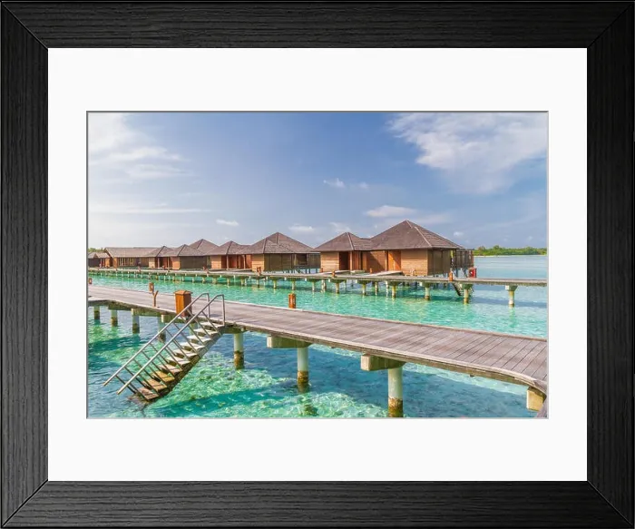 Framed Print : Luxury over water villas in Maldives, wooden jetty and blue lagoon Framed Print : Luxury over water villas in Maldives, wooden jetty and blue lagoon