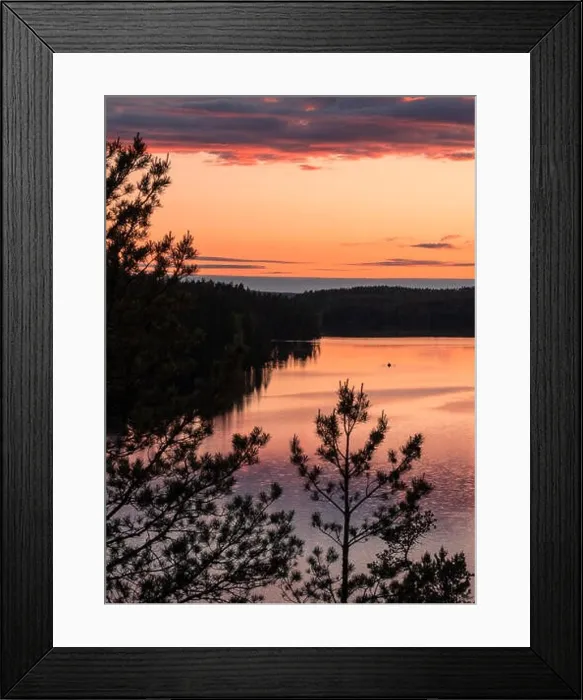 Framed Print : Sunset landscape with peaceful lake and row boat at summer night in Finland Framed Print : Sunset landscape with peaceful lake and row boat at summer night in Finland