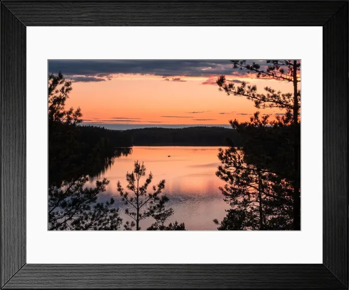 Framed Print : Sunset landscape with peaceful lake and row boat at summer night in Finland Framed Print : Sunset landscape with peaceful lake and row boat at summer night in Finland