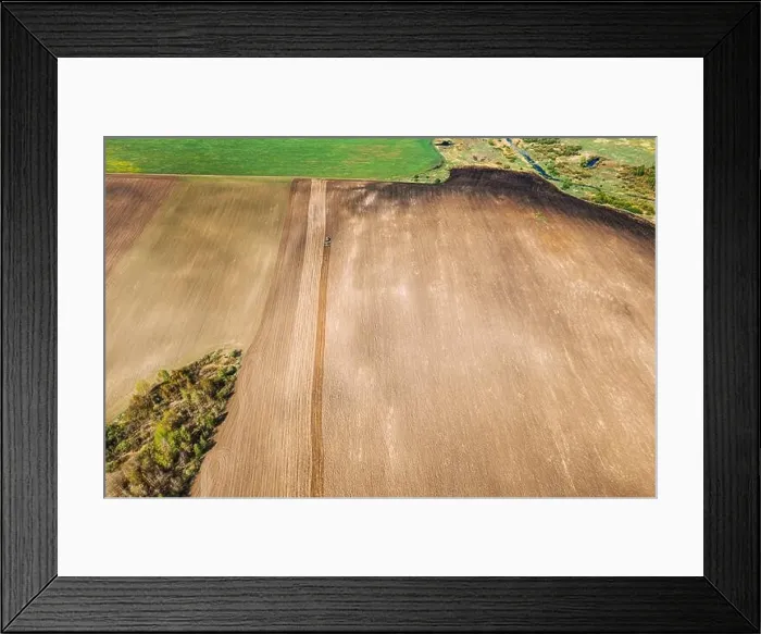 Framed Print : Tractor Plowing Field In Spring. Beginning Of Agricultural Season. Cultivator Pulled By A Tractor In Countryside Rural Field. Countryside Field Framed Print : Tractor Plowing Field In Spring. Beginning Of Agricultural Season. Cultivator Pulled By A Tractor In Countryside Rural Field. Countryside Field