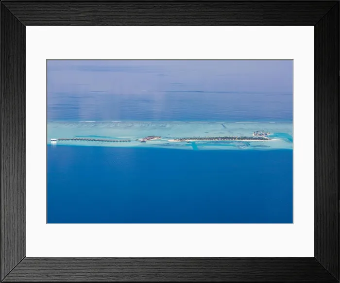 Framed Print : Aerial drone bird's eye view photo of Maldives island and sea. Beautiful turquoise and sapphire clear water beach. Exotic vacation from seaplane view Framed Print : Aerial drone bird's eye view photo of Maldives island and sea. Beautiful turquoise and sapphire clear water beach. Exotic vacation from seaplane view