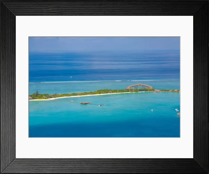 Framed Print : Aerial view of water bungalow and blue sea sky background in Maldives Framed Print : Aerial view of water bungalow and blue sea sky background in Maldives
