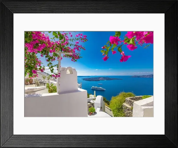 Framed Print : Oia town on Santorini island, Greece. Traditional famous white blue houses wih flowers under sunny weather over Caldera, Aegean sea. Beautiful summer Framed Print : Oia town on Santorini island, Greece. Traditional famous white blue houses wih flowers under sunny weather over Caldera, Aegean sea. Beautiful summer
