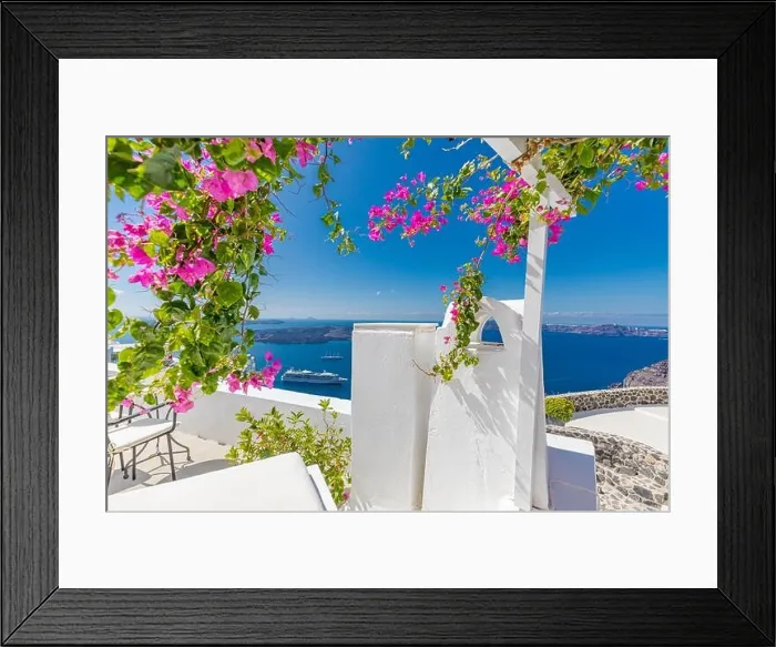 Framed Print : Oia town on Santorini island, Greece. Traditional famous white blue houses wih flowers under sunny weather over Caldera, Aegean sea. Beautiful summer Framed Print : Oia town on Santorini island, Greece. Traditional famous white blue houses wih flowers under sunny weather over Caldera, Aegean sea. Beautiful summer