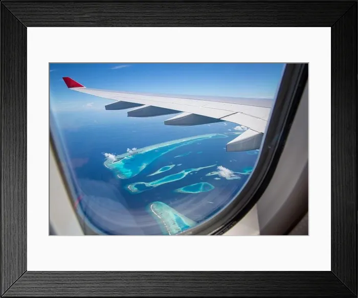 Framed Print : Airplane interior with window view of Maldives island. Concept of travel and air transportation. Maldives islands top view airplane, luxury tourism Framed Print : Airplane interior with window view of Maldives island. Concept of travel and air transportation. Maldives islands top view airplane, luxury tourism