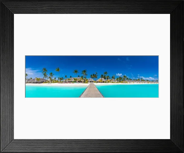 Framed Print : Panoramic view of exotic palm trees and lagoon on the tropical Island beach. Luxury resort hotel, villas, bungalows with wooden jetty. Amazing travel Framed Print : Panoramic view of exotic palm trees and lagoon on the tropical Island beach. Luxury resort hotel, villas, bungalows with wooden jetty. Amazing travel