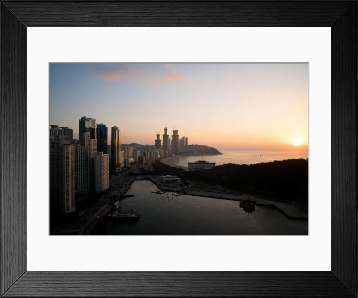 Framed Print : Sunrise at Haeundae beach in Busan. Haeundae beach is Busan's most popular beach in South Korea Framed Print : Sunrise at Haeundae beach in Busan. Haeundae beach is Busan's most popular beach in South Korea