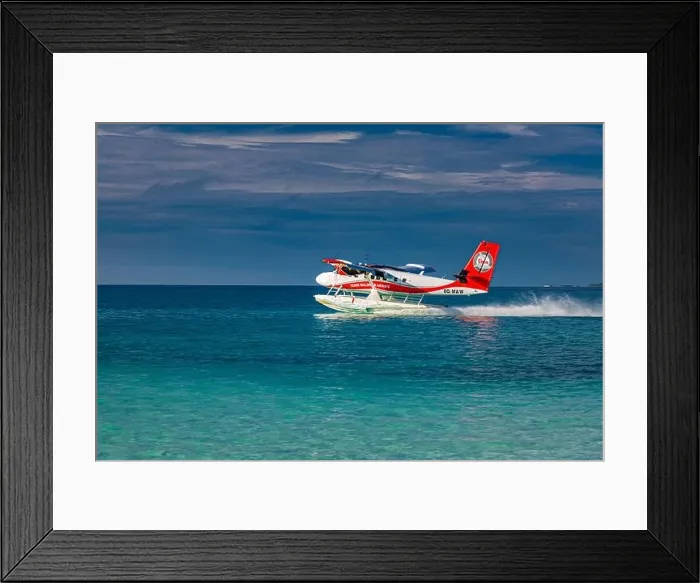 Framed Print : Ari Atoll, Maldives - 05.05.2019: Maldives seaplane on luxury resort, wooden jetty loading the plane, ready for departure. Tropical island background Framed Print : Ari Atoll, Maldives - 05.05.2019: Maldives seaplane on luxury resort, wooden jetty loading the plane, ready for departure. Tropical island background