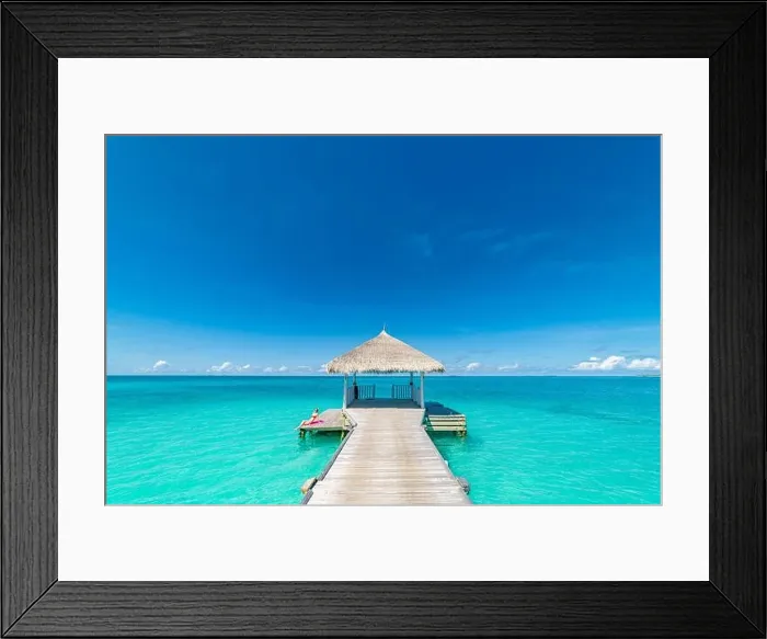 Framed Print : Maldives island beach. Tropical landscape of summer scenery, sea sand sky over jetty pier. Luxury travel vacation destination. Exotic beach landscape Framed Print : Maldives island beach. Tropical landscape of summer scenery, sea sand sky over jetty pier. Luxury travel vacation destination. Exotic beach landscape