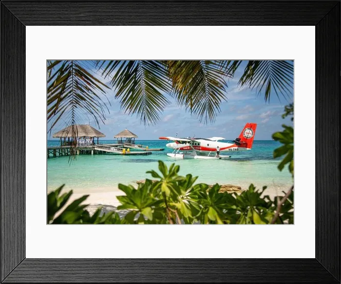 Framed Print : Ari Atoll, Maldives - 05.05.2019: Maldives seaplane on luxury resort, wooden jetty loading the plane, ready for departure. Tropical island background Framed Print : Ari Atoll, Maldives - 05.05.2019: Maldives seaplane on luxury resort, wooden jetty loading the plane, ready for departure. Tropical island background