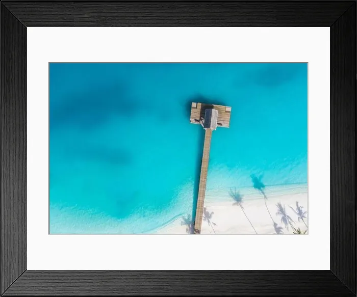 Framed Print : Beautiful aerial view of poolside and resort beach with wooden pier jetty. Luxurious tropical beach landscape, swimming, ocean lagoon Framed Print : Beautiful aerial view of poolside and resort beach with wooden pier jetty. Luxurious tropical beach landscape, swimming, ocean lagoon