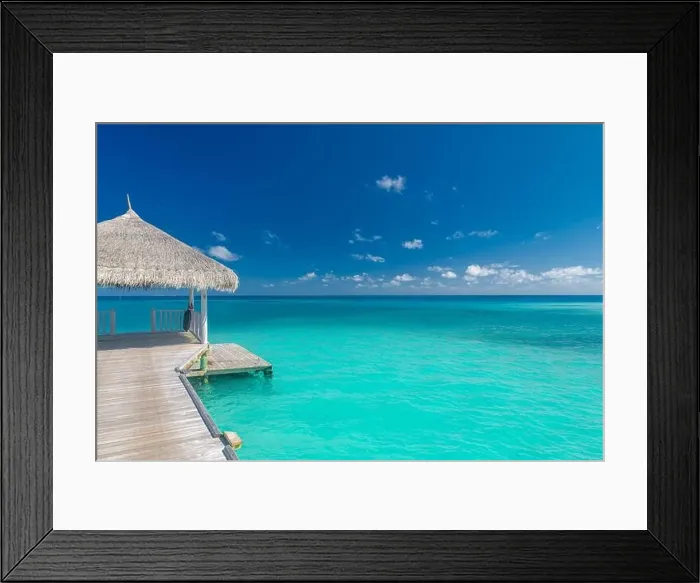 Framed Print : Maldives island beach. Tropical landscape of summer scenery, sea sand sky over jetty pier. Luxury travel vacation destination. Exotic beach landscape Framed Print : Maldives island beach. Tropical landscape of summer scenery, sea sand sky over jetty pier. Luxury travel vacation destination. Exotic beach landscape