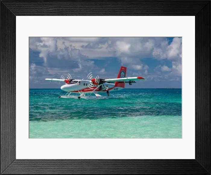Framed Print : Ari Atoll, Maldives - 05.05.2019: Maldives seaplane on luxury resort, wooden jetty loading the plane, ready for departure. Tropical island background Framed Print : Ari Atoll, Maldives - 05.05.2019: Maldives seaplane on luxury resort, wooden jetty loading the plane, ready for departure. Tropical island background